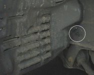 Prise centre piece of plastic retainer to remove
